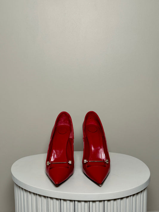 Red patent leather pumps