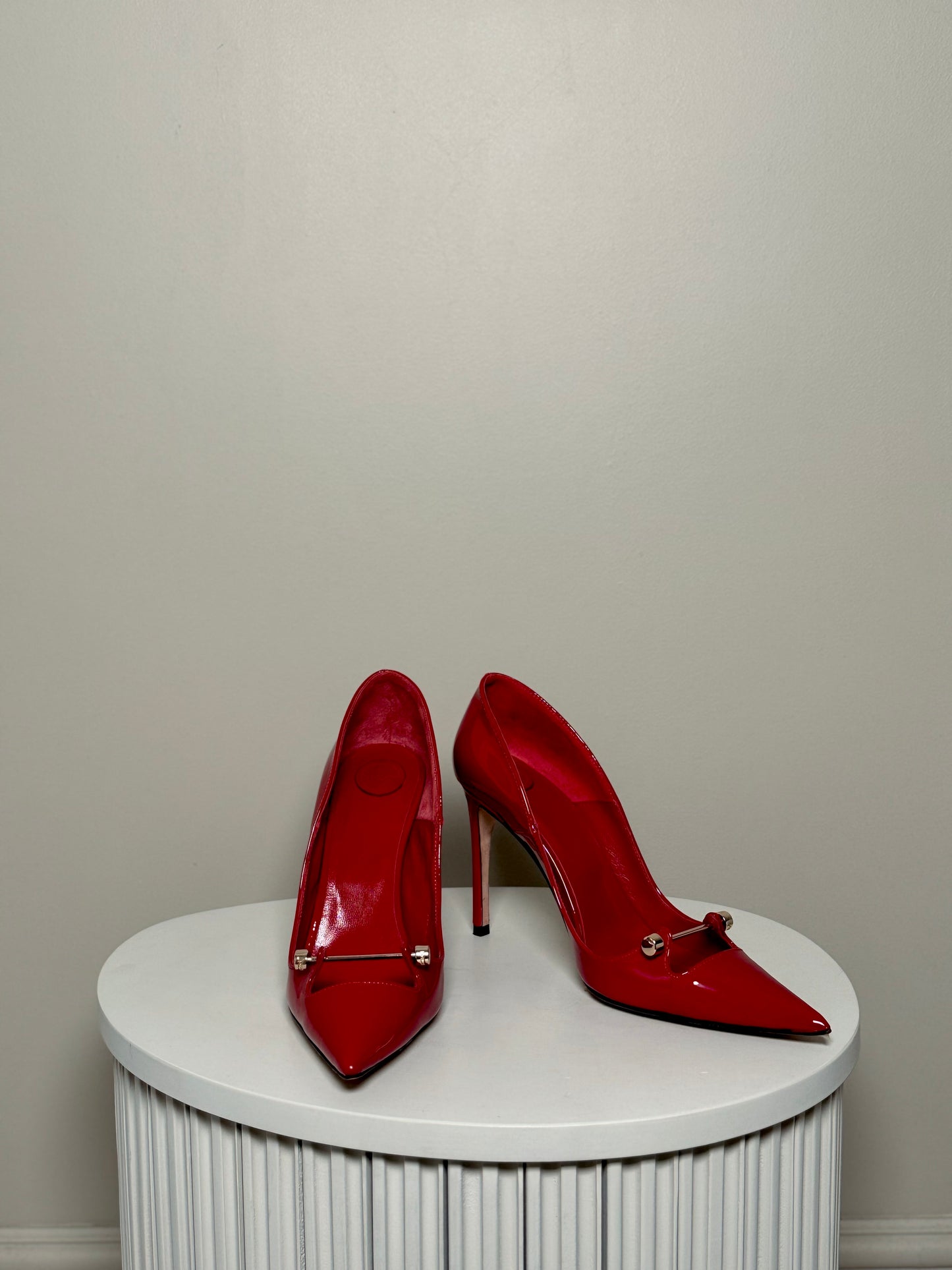 Red patent leather pumps