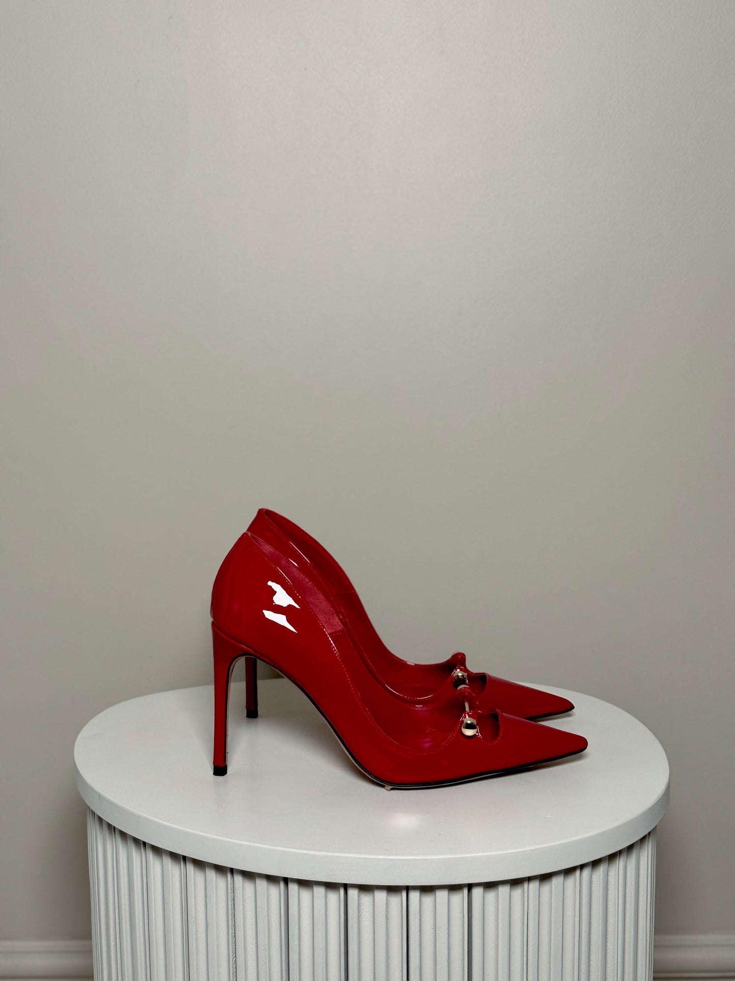 Red patent leather pumps