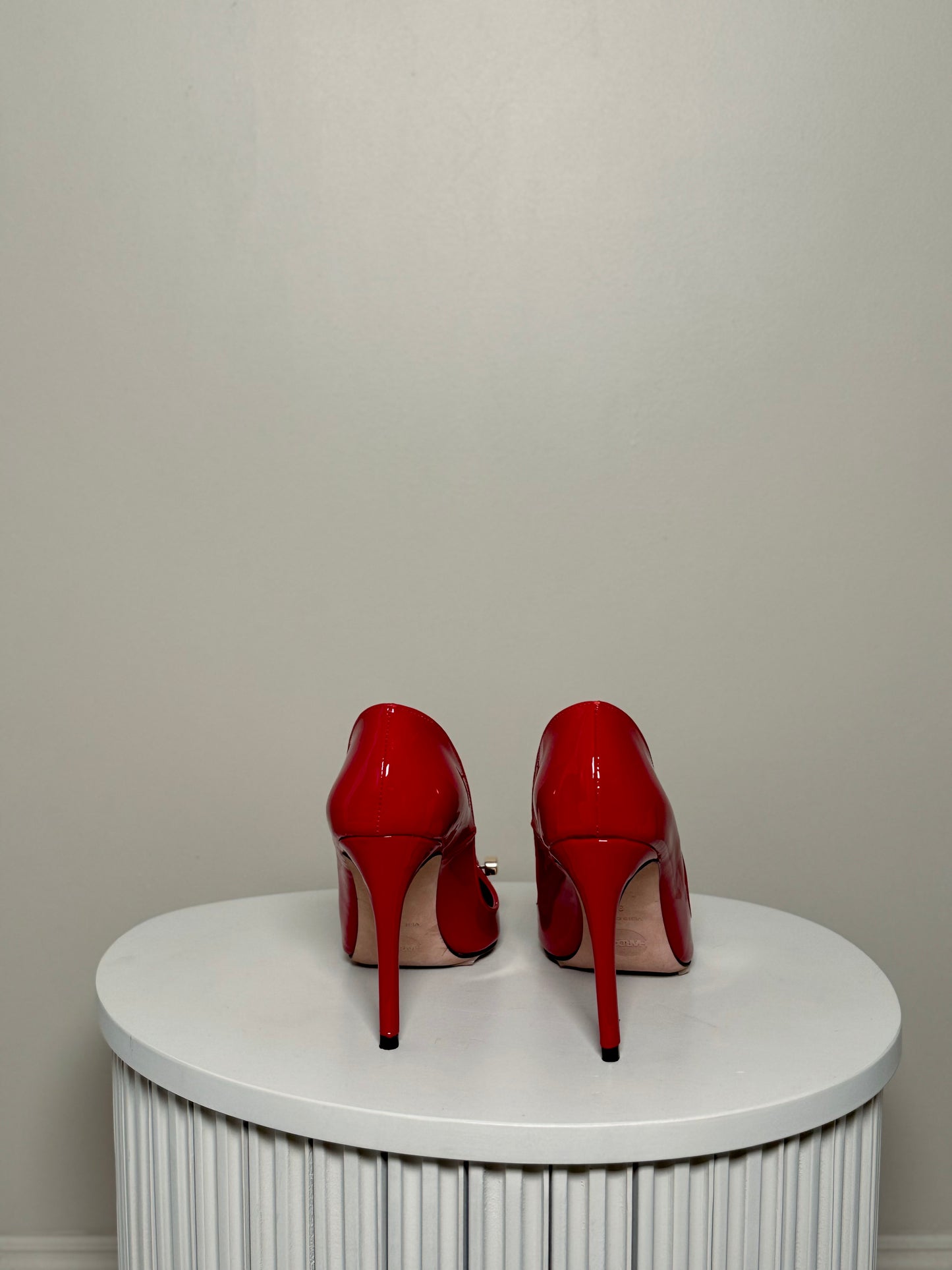 Red patent leather pumps